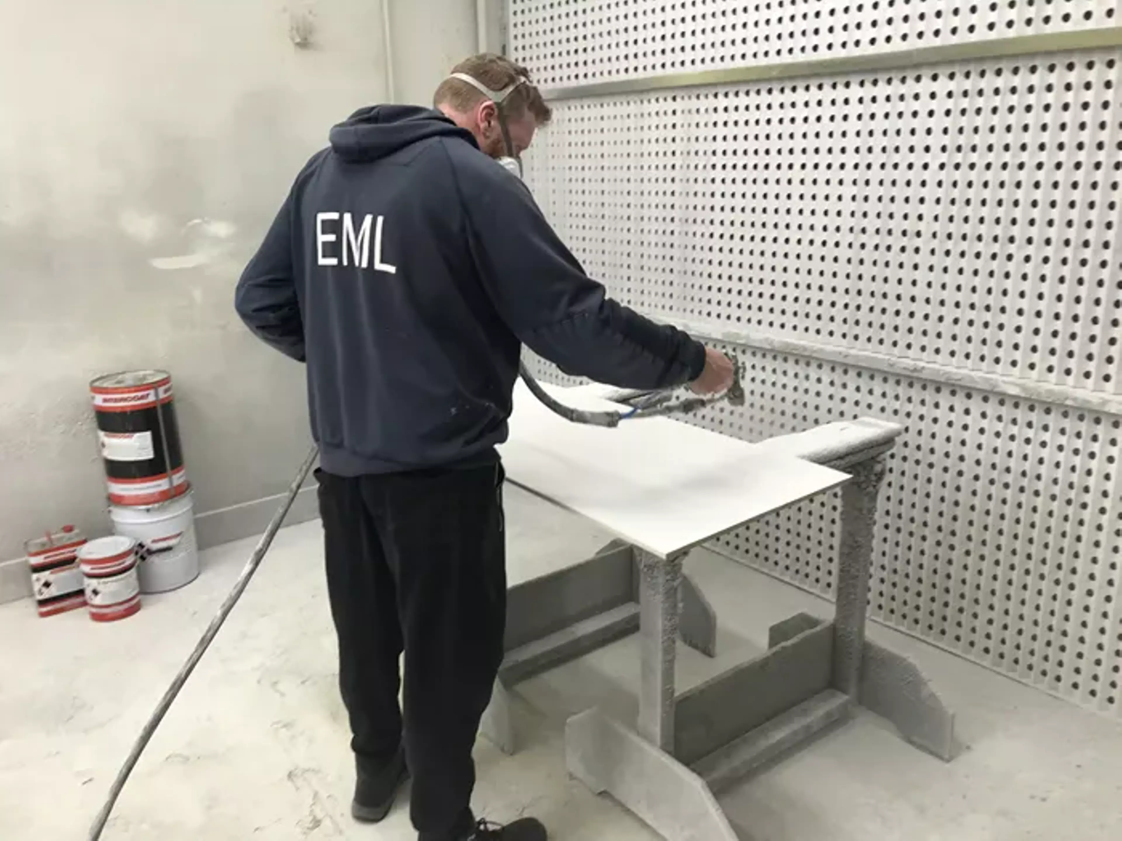 Man spraying panel